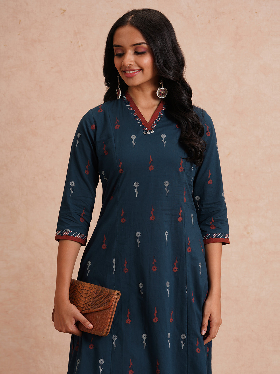 Printed A-line kurta with contrast fabric detailing with mirror work.