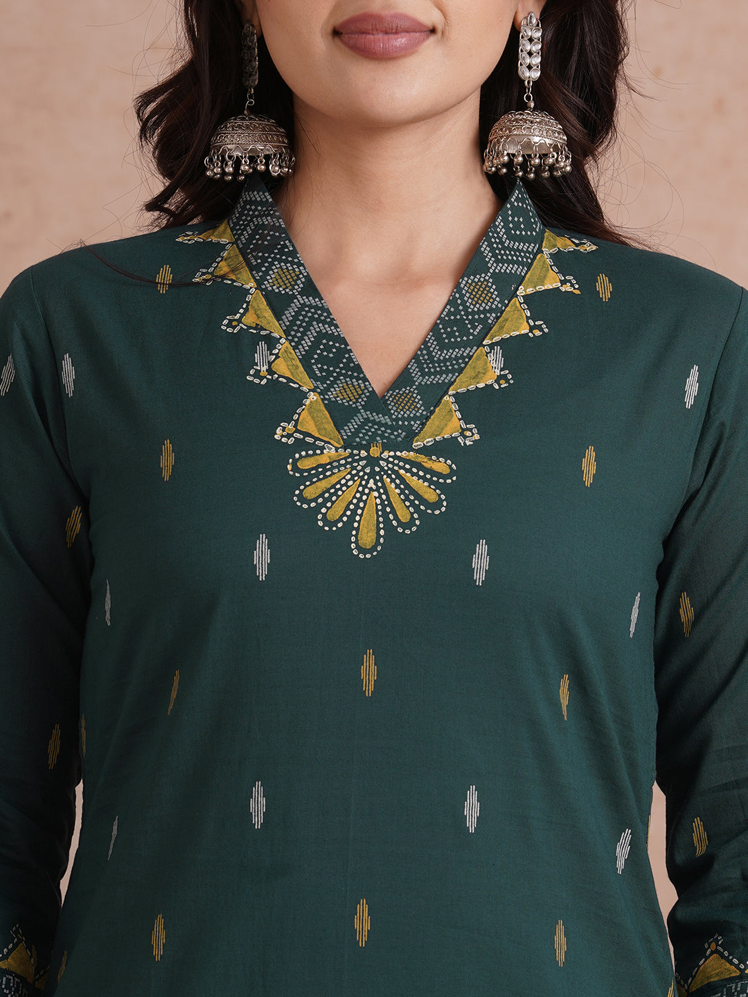 Straight fit cotton printed kurta with block printed neckline and sleeves.