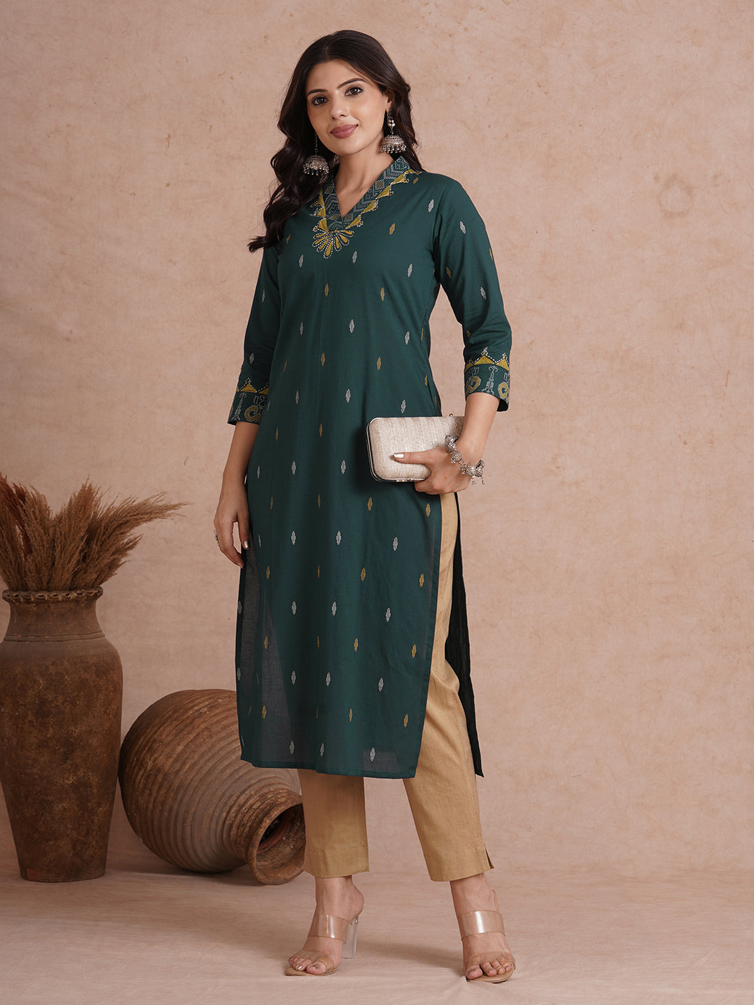 Straight fit cotton printed kurta with block printed neckline and sleeves.