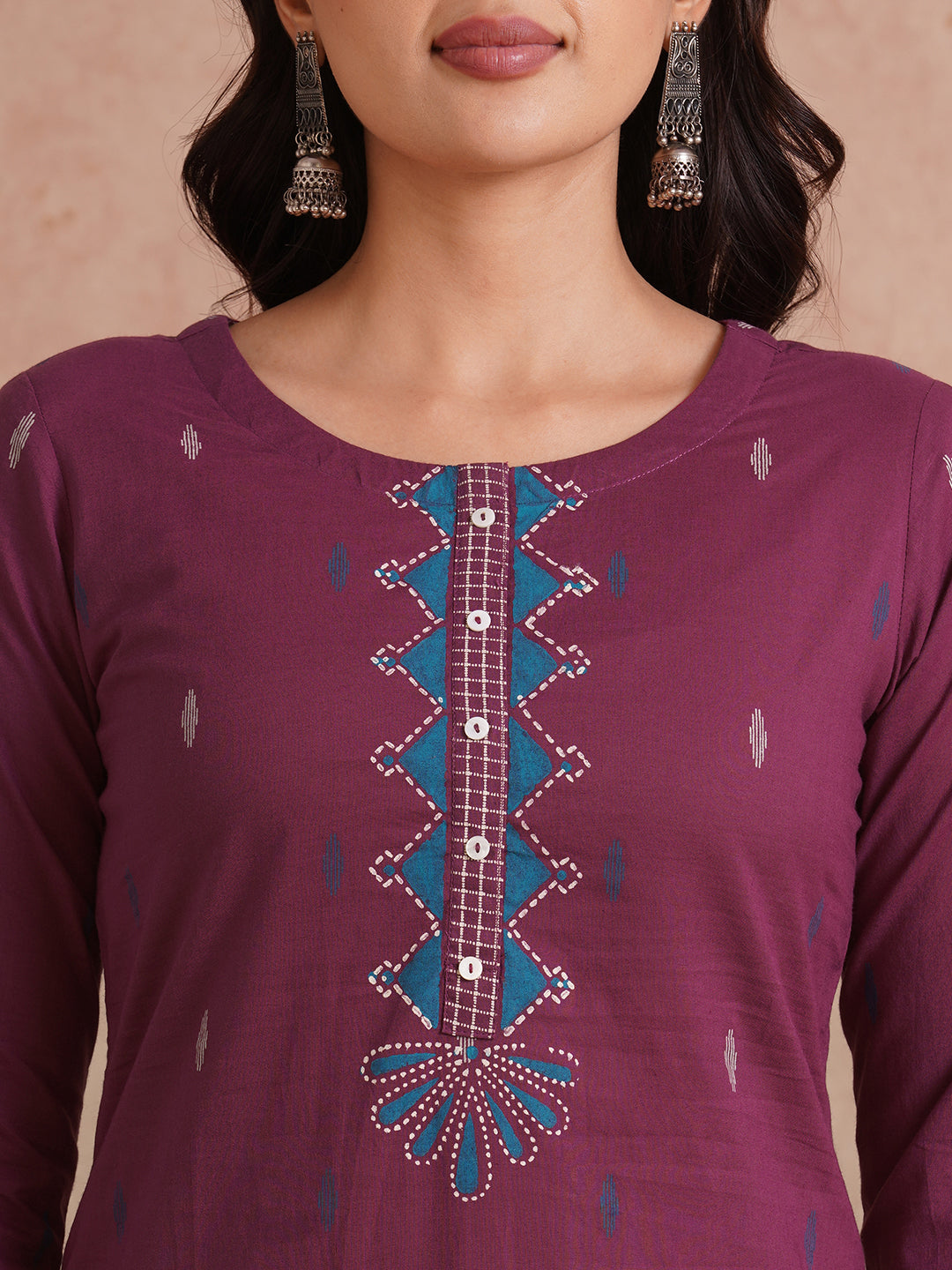 Straight fit printed kurta with trim fabric placket and cuff highlighted with block print.