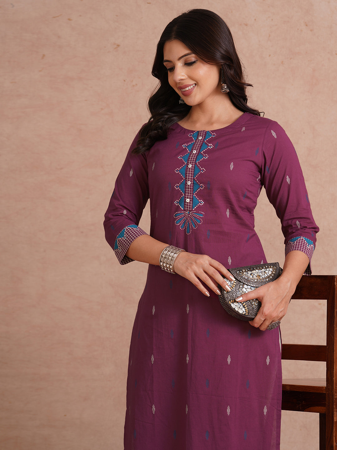 Straight fit printed kurta with trim fabric placket and cuff highlighted with block print.