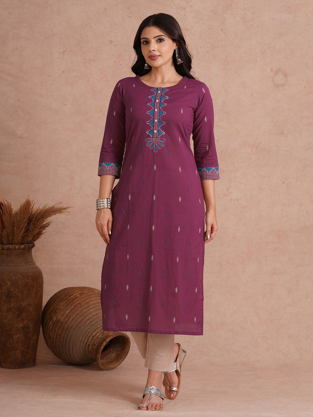 Straight fit printed kurta with trim fabric placket and cuff highlighted with block print.
