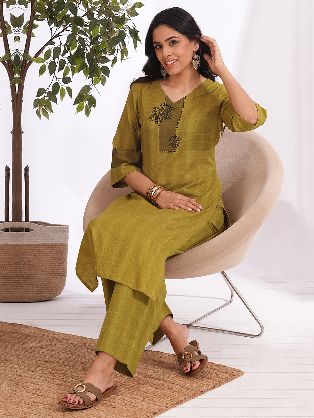 Straight fit woven checks kurta with asymmetrical block print highlighted with buttons and bell sleeves