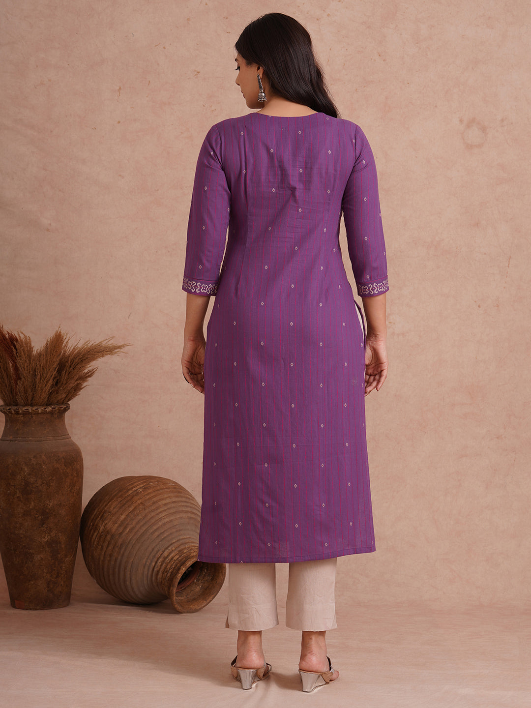 Straight fit dobby stripe kurta with block printed neckline and placement block on hem.