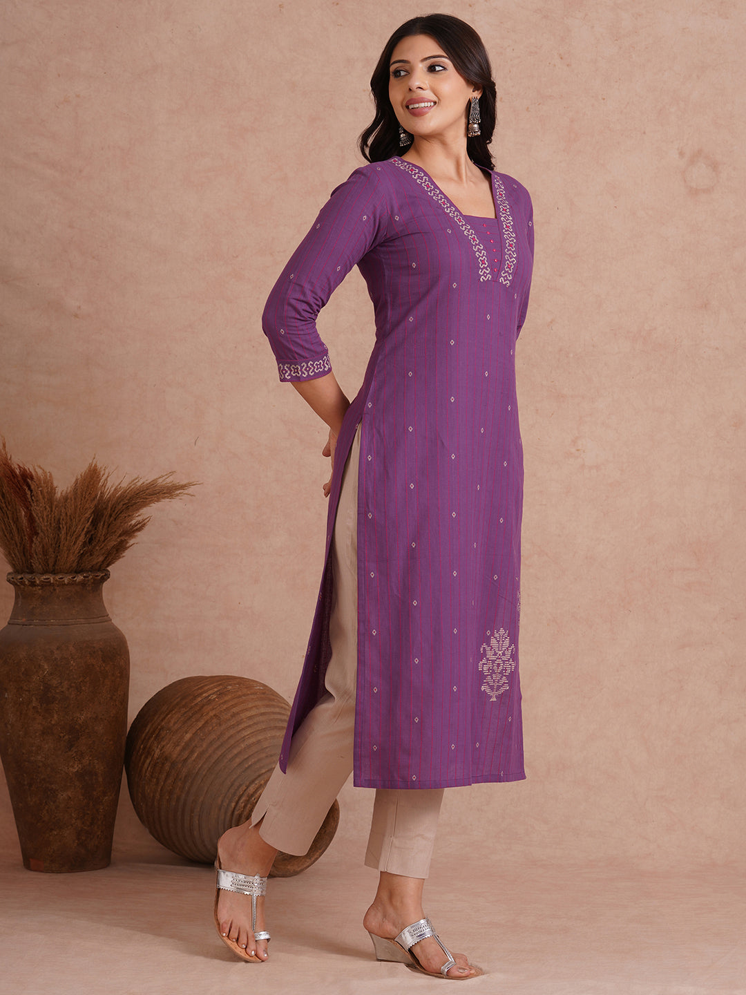 Straight fit dobby stripe kurta with block printed neckline and placement block on hem.