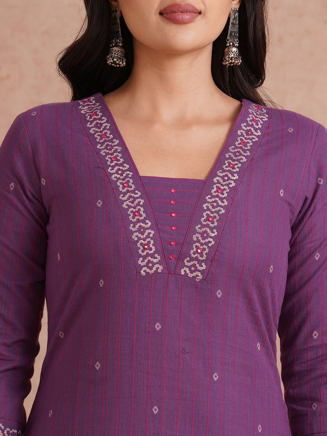 Straight fit dobby stripe kurta with block printed neckline and placement block on hem.