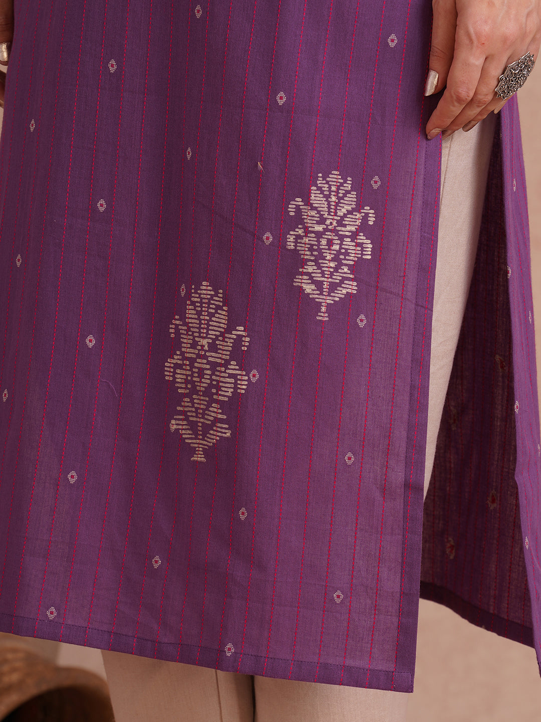 Straight fit dobby stripe kurta with block printed neckline and placement block on hem.