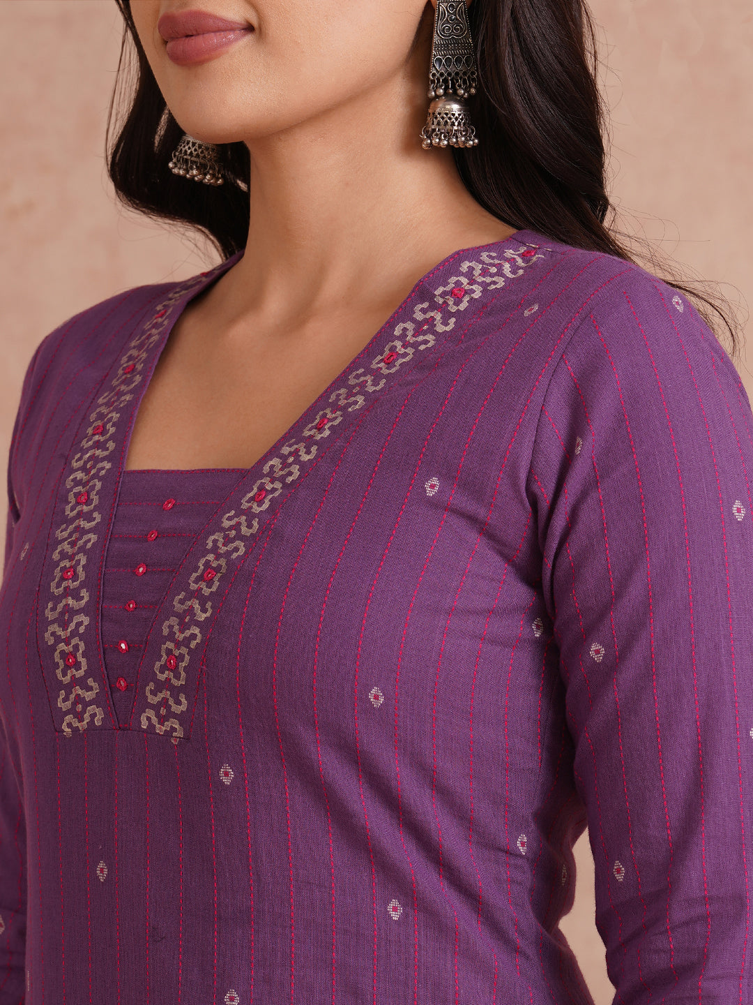 Straight fit dobby stripe kurta with block printed neckline and placement block on hem.