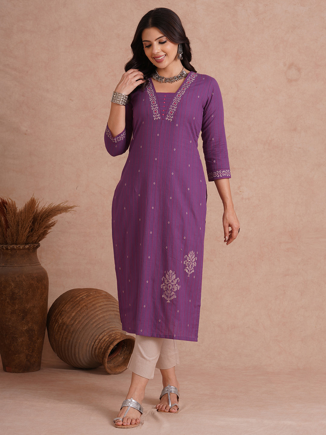 Straight fit dobby stripe kurta with block printed neckline and placement block on hem.