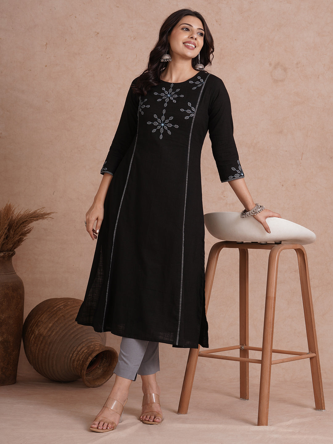 A-line shoulder princess kurta with machine applique on front and sleeves.