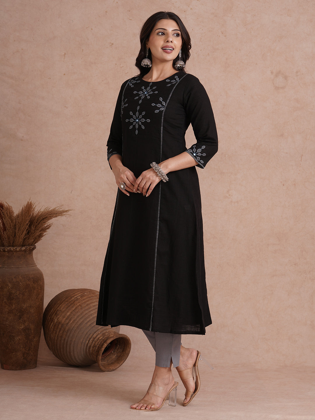 A-line shoulder princess kurta with machine applique on front and sleeves.