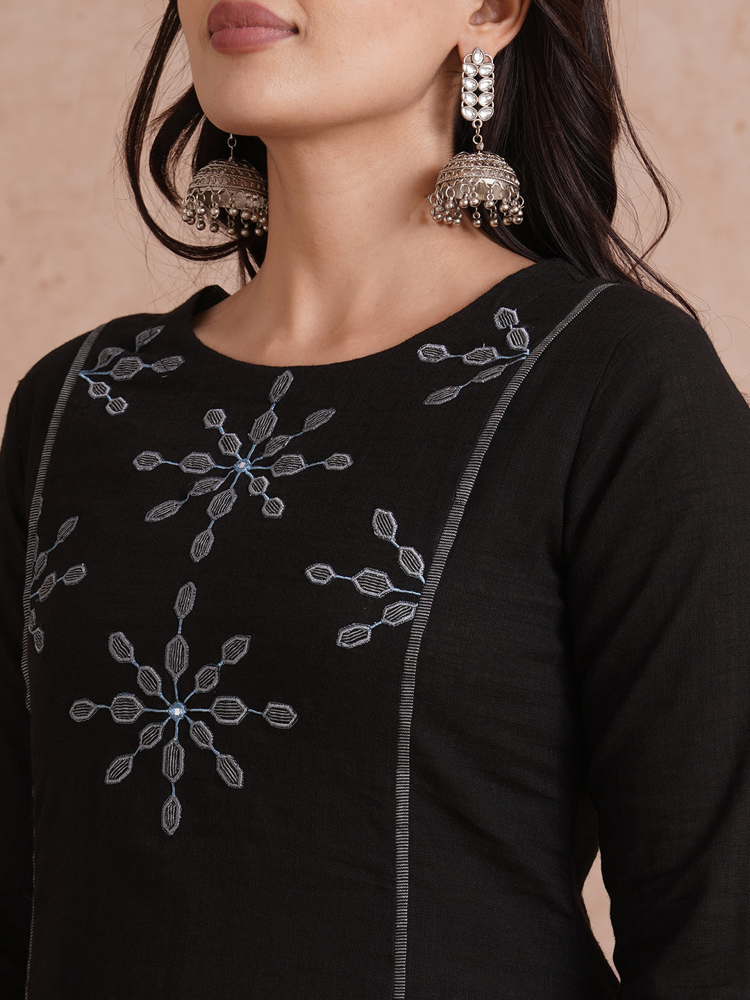 A-line shoulder princess kurta with machine applique on front and sleeves.