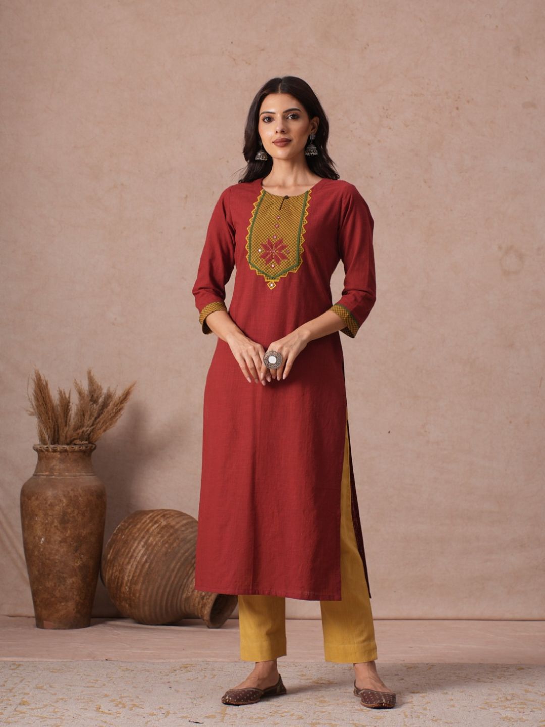 Cotton Straight Fit Kurta with Machine Applique and Contrast Fabric Sleeve Trims.