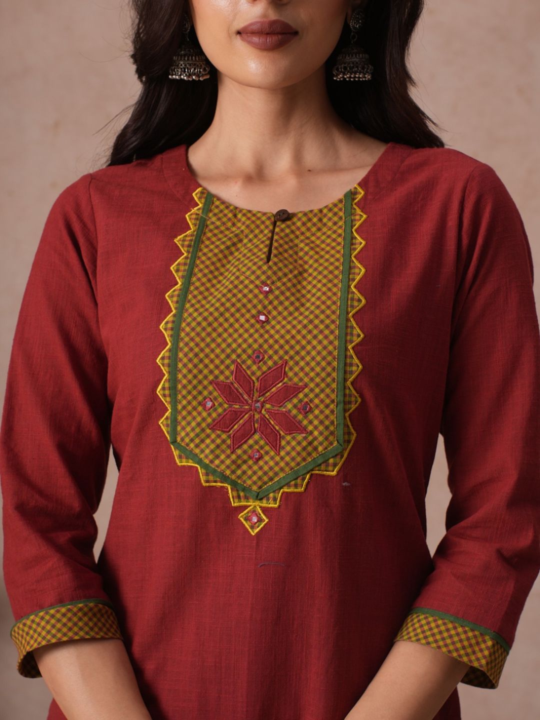 Cotton Straight Fit Kurta with Machine Applique and Contrast Fabric Sleeve Trims.