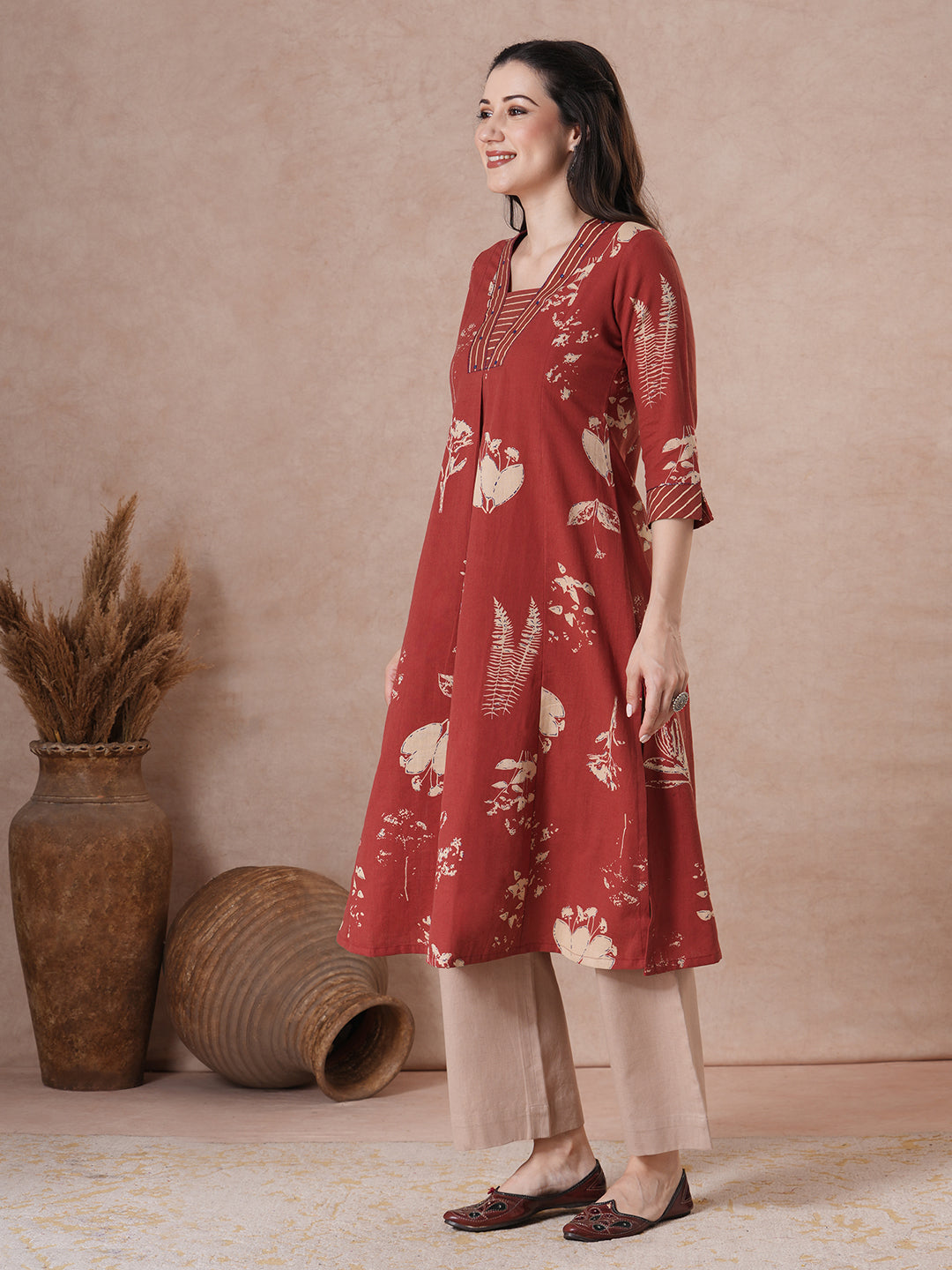Botanical Print A-Line Kurta with Striped Trim & Handwork Detail.