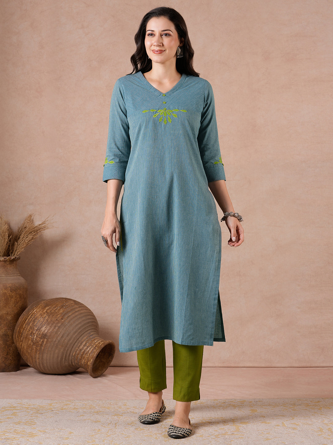 Straight Fit Cotton Kurta with Bias Yoke & Geometric Applique Detail.