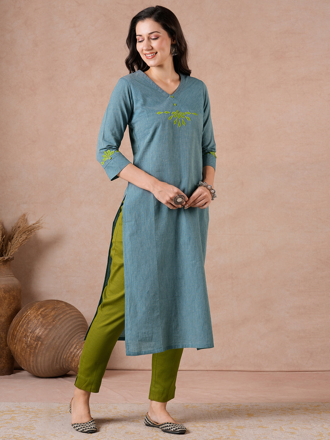 Straight Fit Cotton Kurta with Bias Yoke & Geometric Applique Detail.