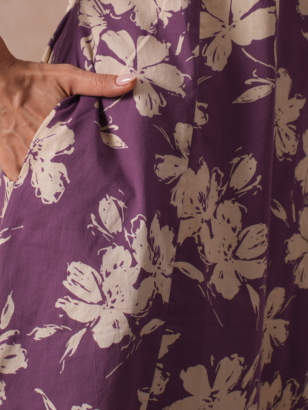 A-line Printed Cotton Kurta with Hand Sequined Yoke and Stylish Tie-Up Sleeves.