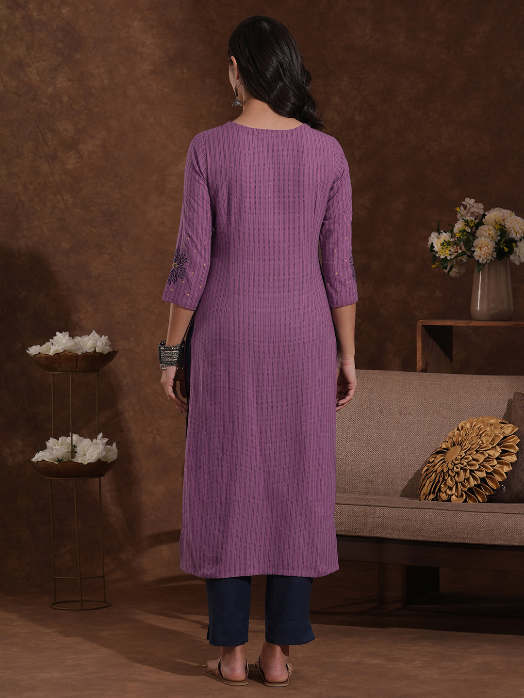 Straight fit kantha stripe kurta with block print and mirror work on the neck and sleeves.