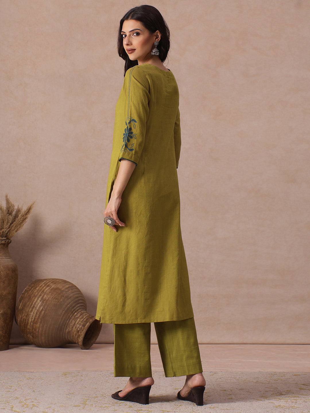 Straight Fit Cotton Kurta with Handwork Placket and Machine Applique Sleeve Detail.