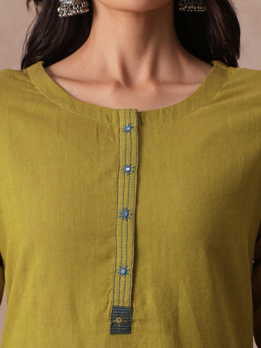 Straight Fit Cotton Kurta with Handwork Placket and Machine Applique Sleeve Detail.