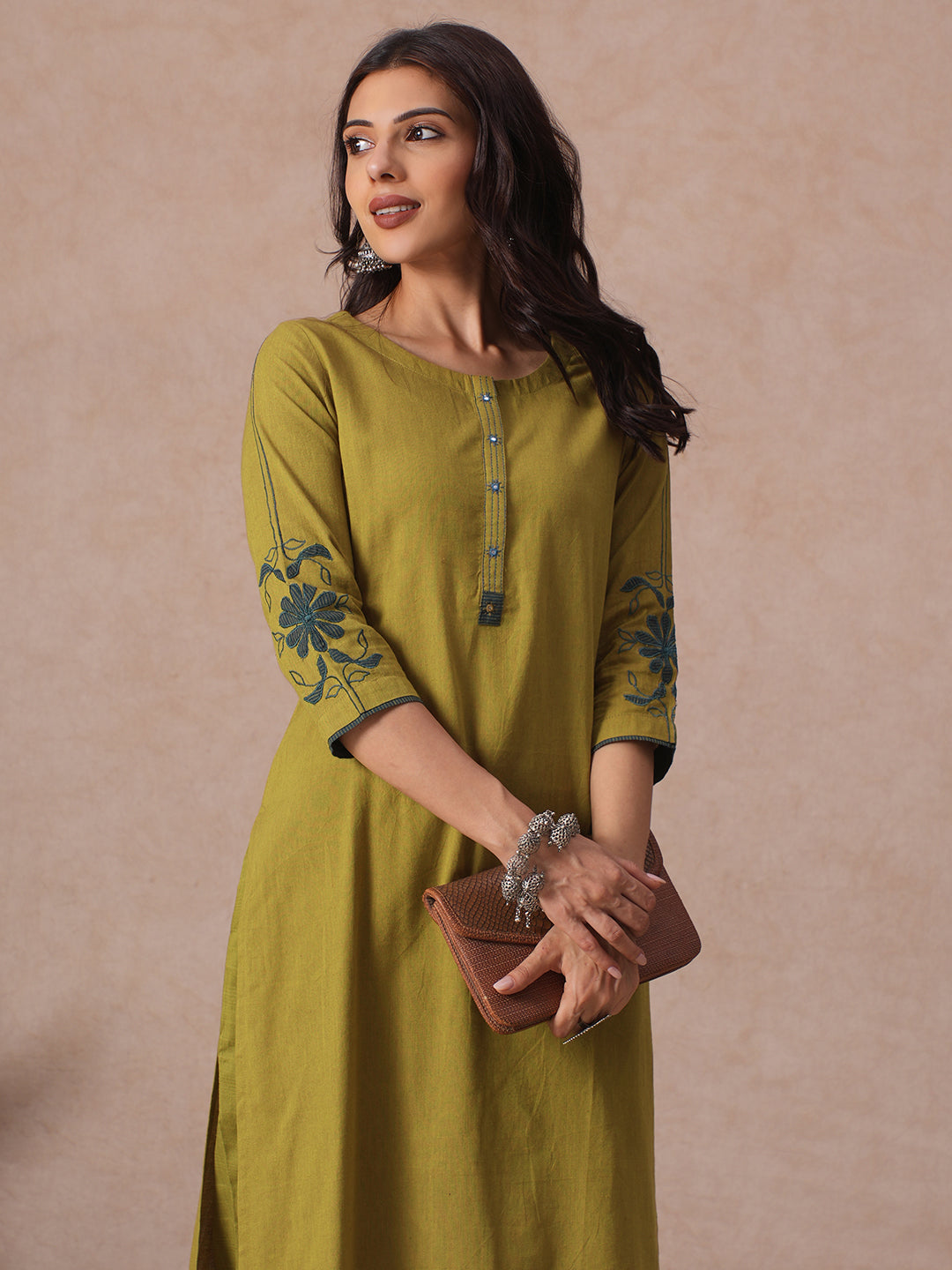 Straight Fit Cotton Kurta with Handwork Placket and Machine Applique Sleeve Detail.