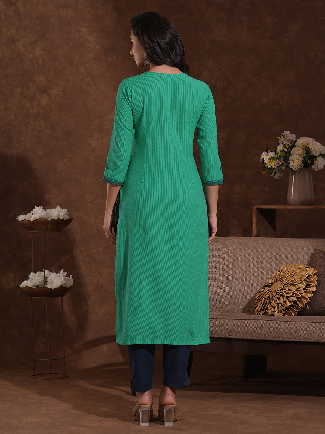 Straight fit kurta with block printed yoke and sleeves highlighted with handwork mirrors.