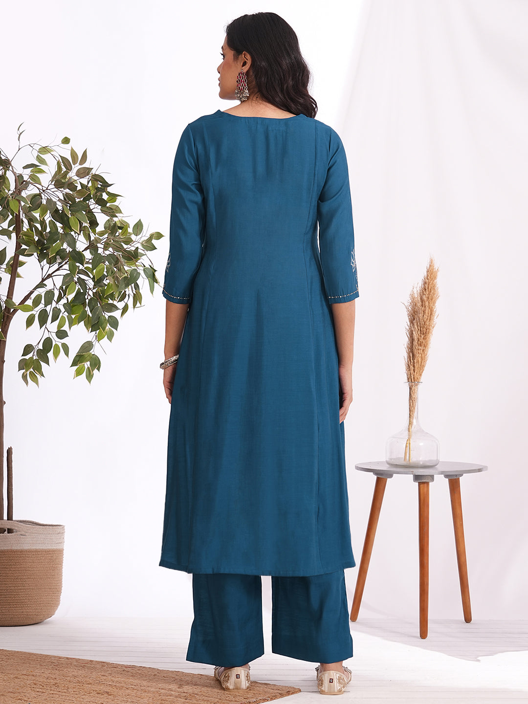 A-line kurta in silk blend fabric with Zari and thread embroidery paired with lined palazzo