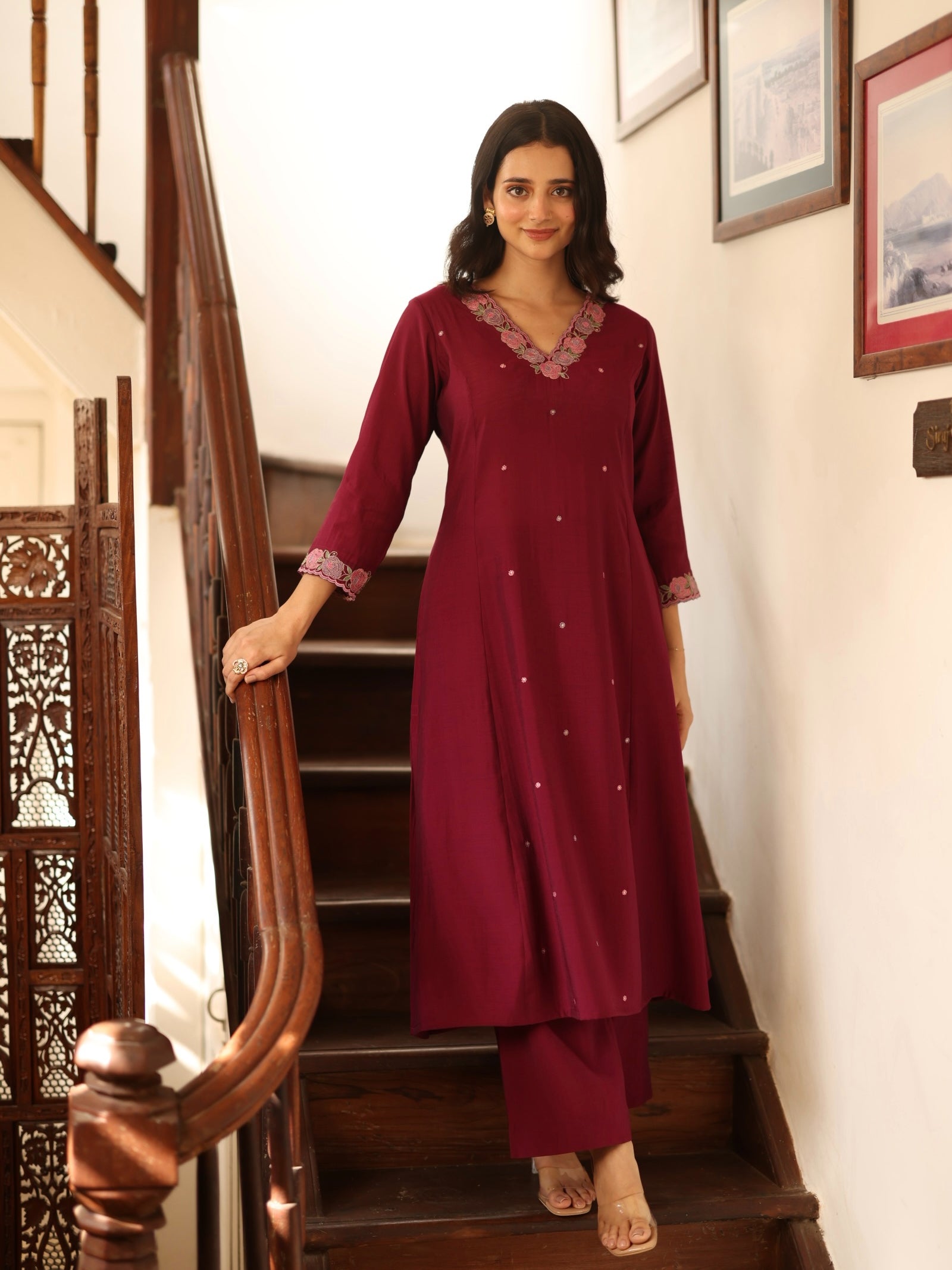 A-line kurta in silk blend fabric with thread and Zari embroidery paired with lined art silk palazzo