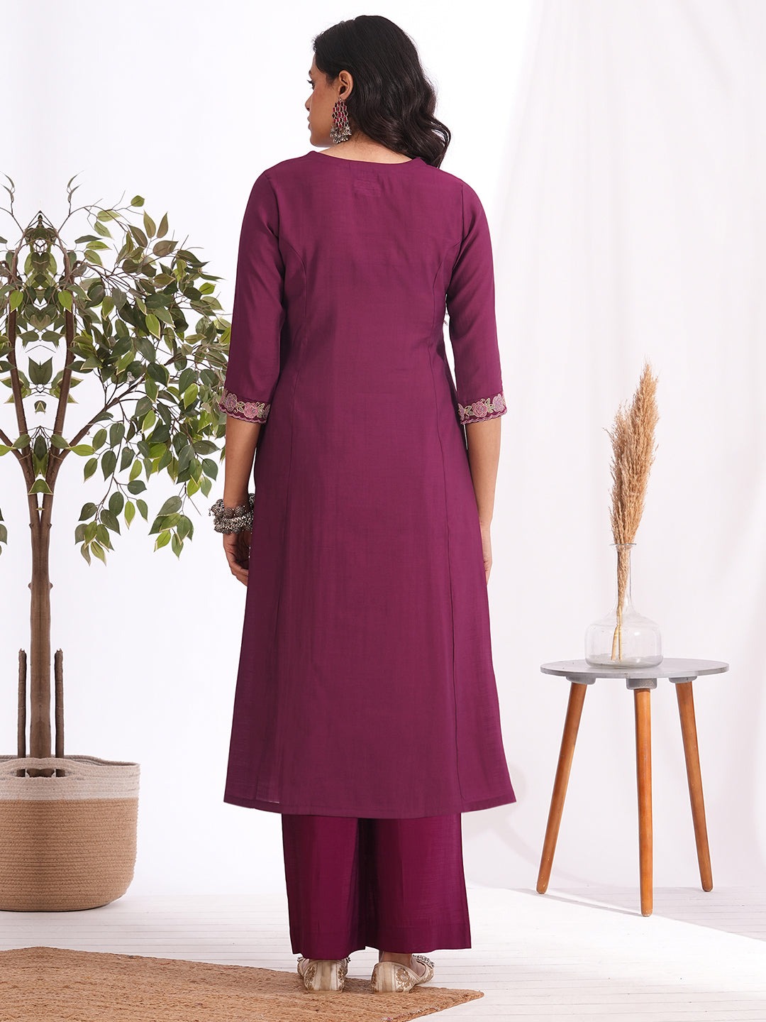 A-line kurta in silk blend fabric with thread and Zari embroidery paired with lined art silk palazzo