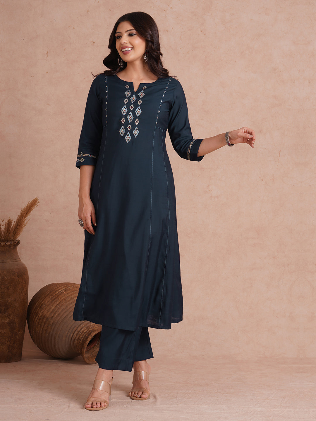 Party Edit- Pocketed and embroidered kurta in art silk fabric paired with lined art silk palazzo.