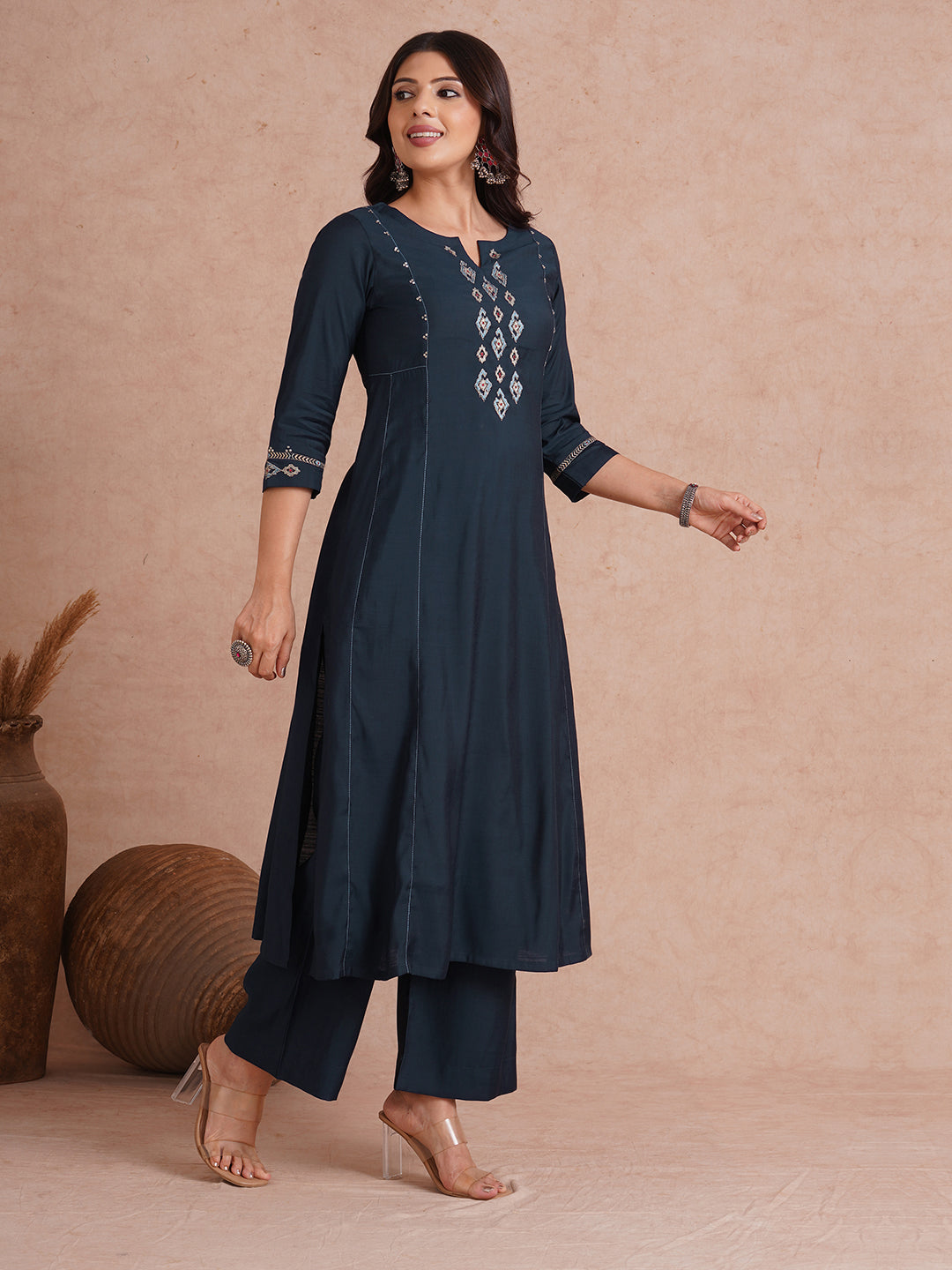 Party Edit- Pocketed and embroidered kurta in art silk fabric paired with lined art silk palazzo.