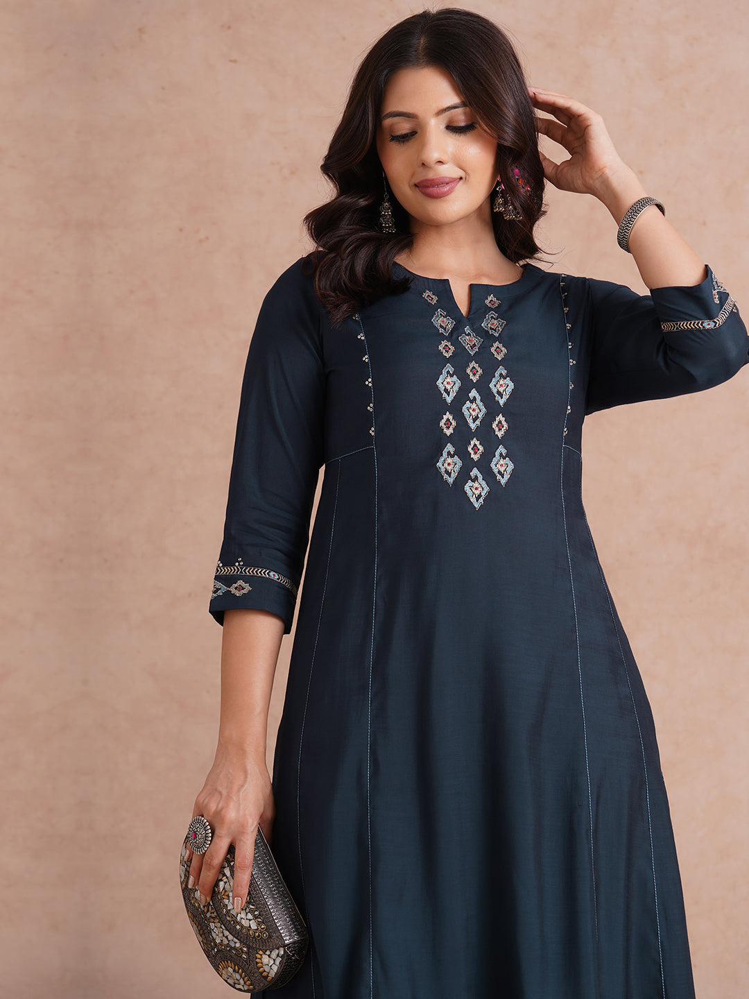 Party Edit- Pocketed and embroidered kurta in art silk fabric paired with lined art silk palazzo.