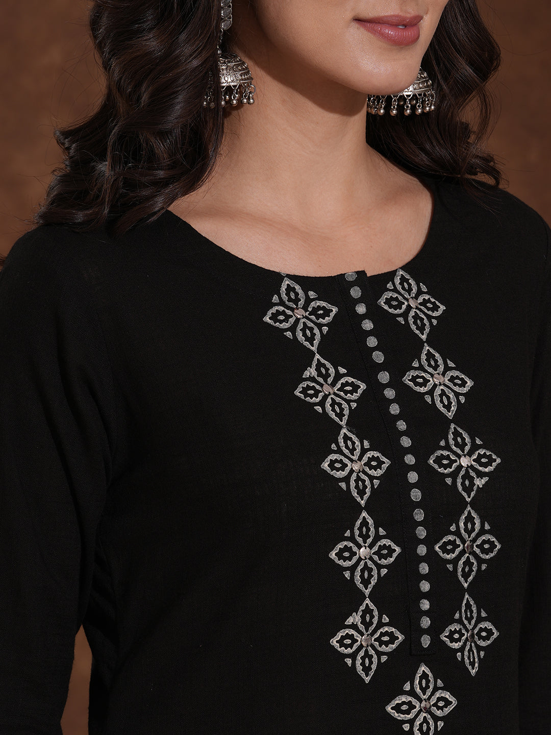 A-line kurta with block printed front and sleeves paired with printed palazzos.