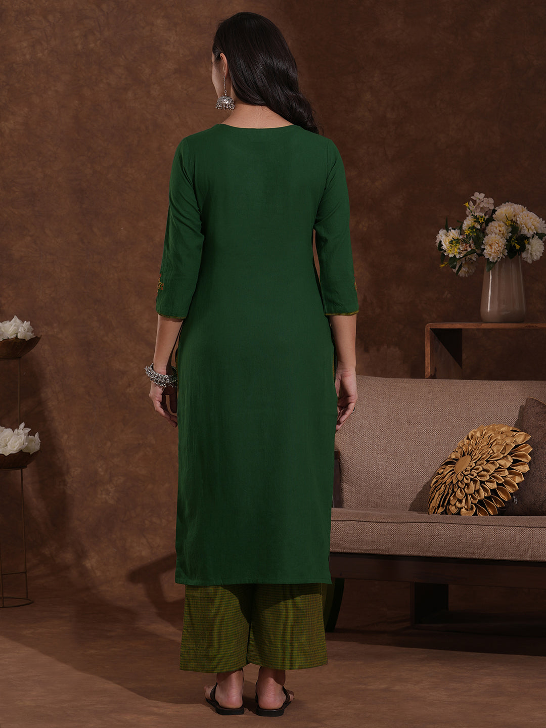 Straight fit kurta with Machine embroidery paired with woven checks palazzo.