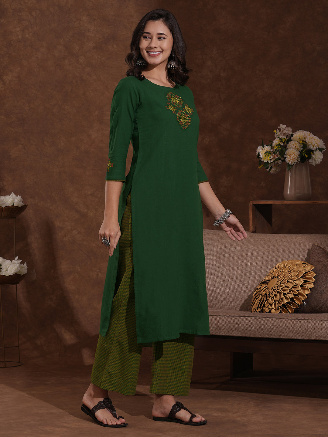 Straight fit kurta with Machine embroidery paired with woven checks palazzo.