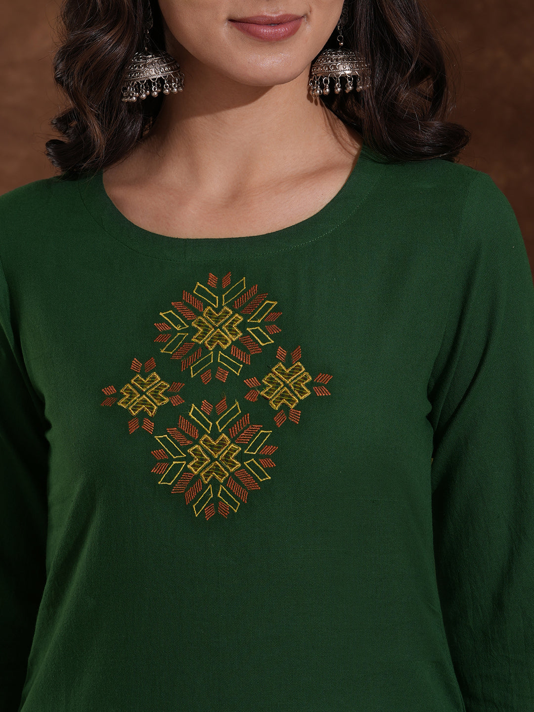 Straight fit kurta with Machine embroidery paired with woven checks palazzo.