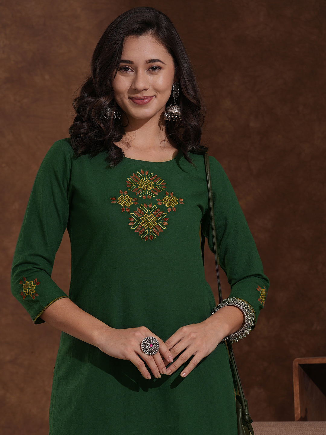 Straight fit kurta with Machine embroidery paired with woven checks palazzo.