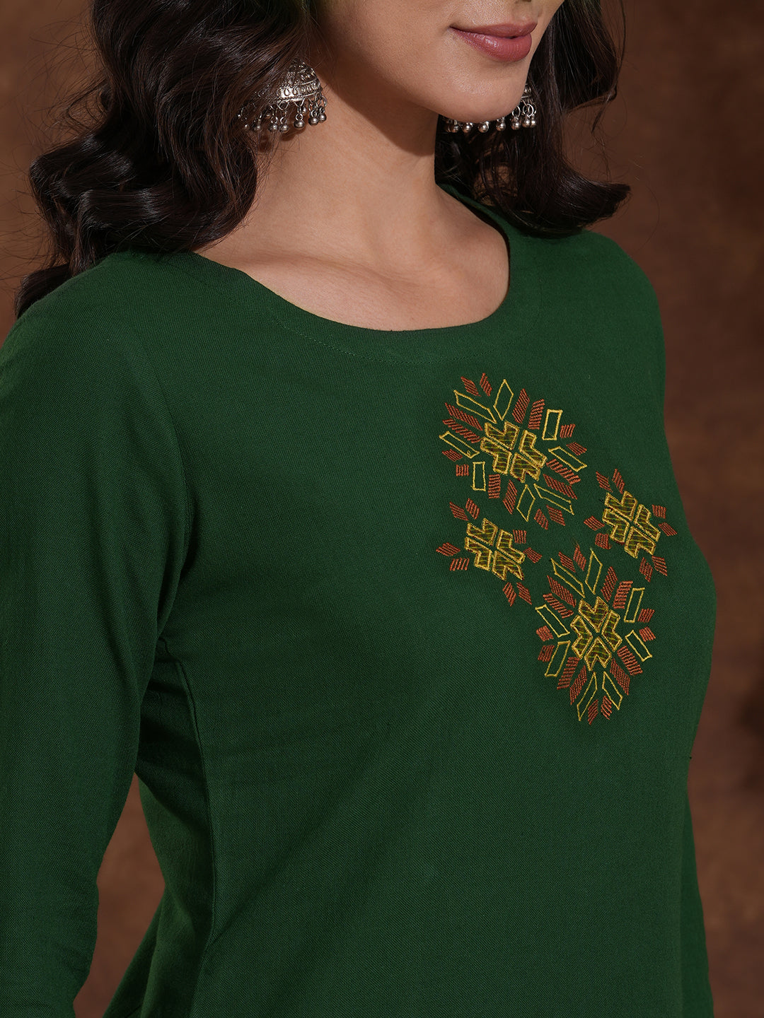 Straight fit kurta with Machine embroidery paired with woven checks palazzo.