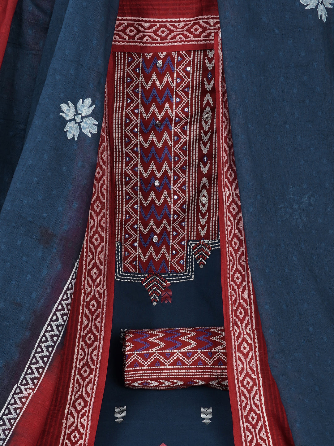 3-piece unstitched suit set featuring a butti-printed kurta with coordinated yoke detailing.