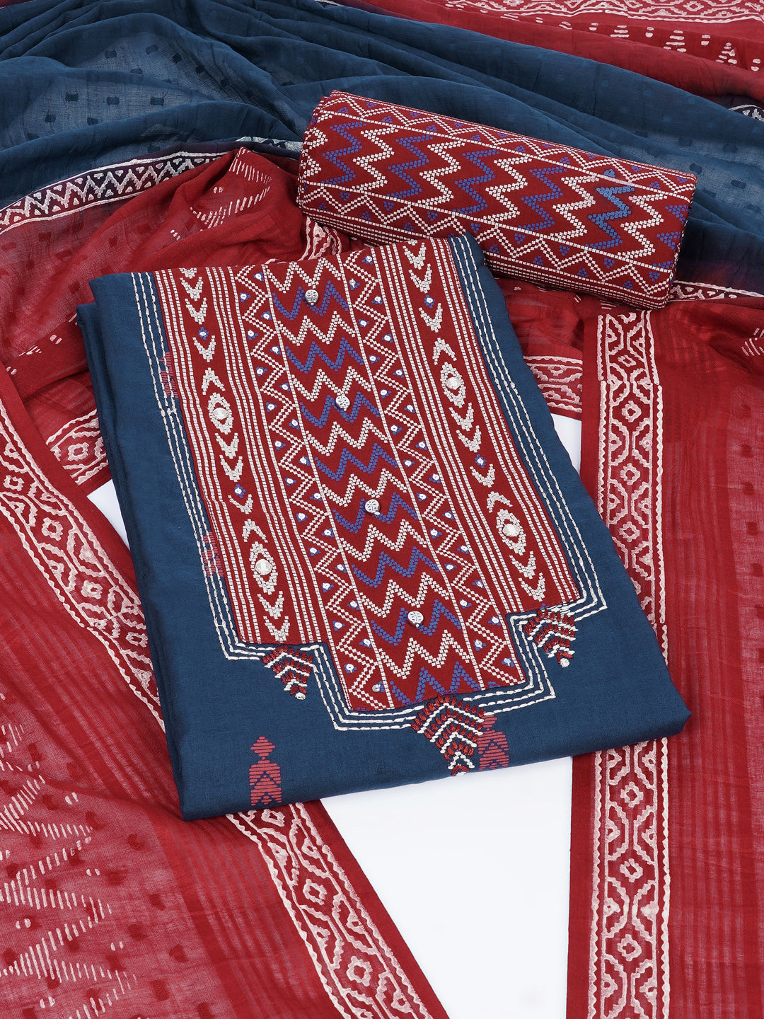 3-piece unstitched suit set featuring a butti-printed kurta with coordinated yoke detailing.