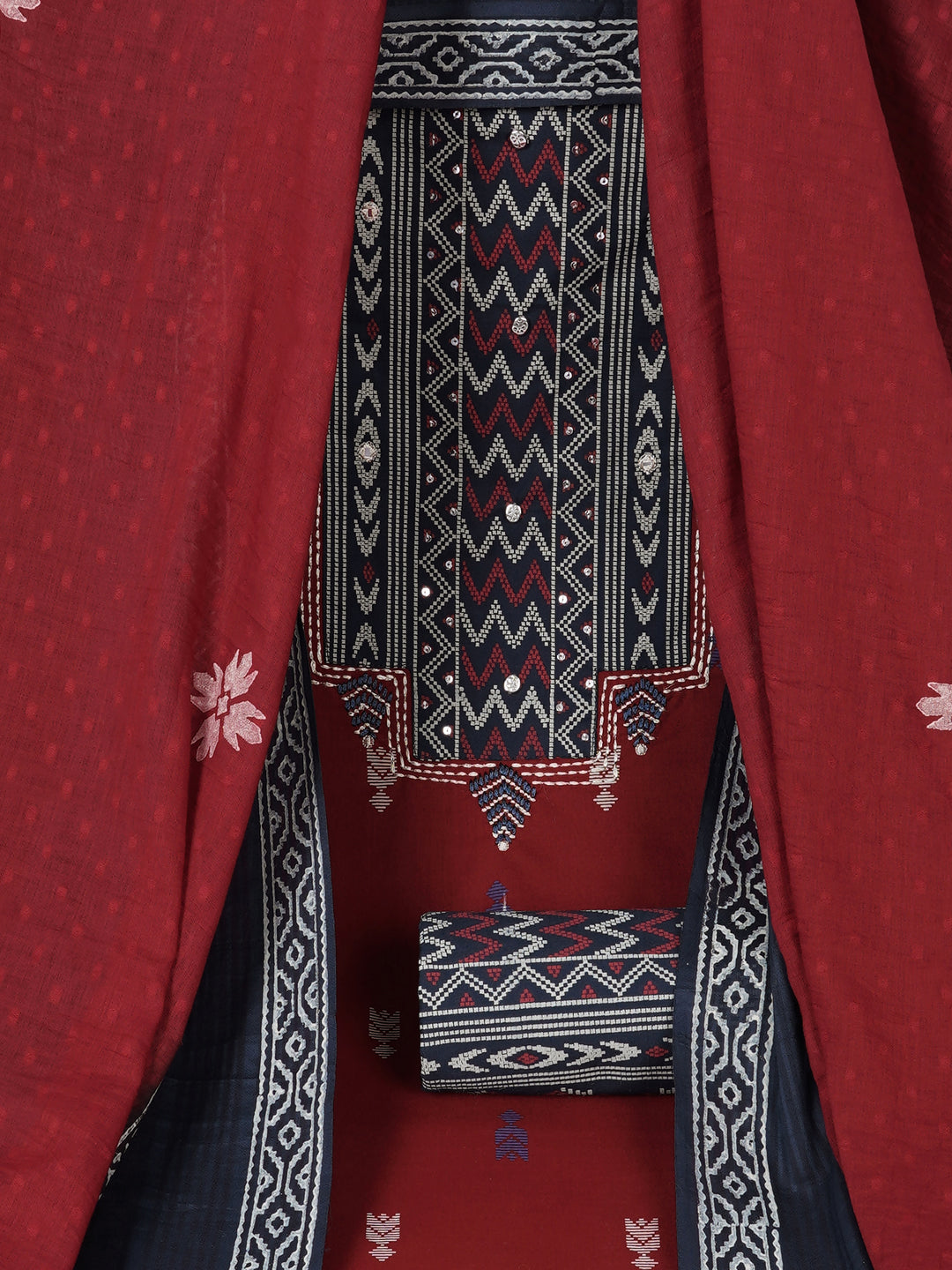 3-piece unstitched suit set featuring a butti-printed kurta with coordinated yoke detailing.