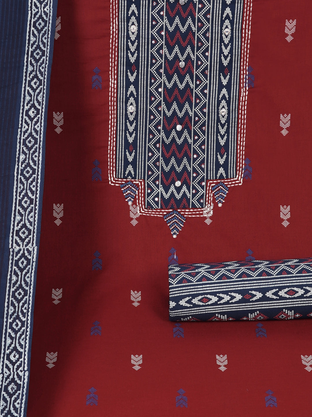 3-piece unstitched suit set featuring a butti-printed kurta with coordinated yoke detailing.