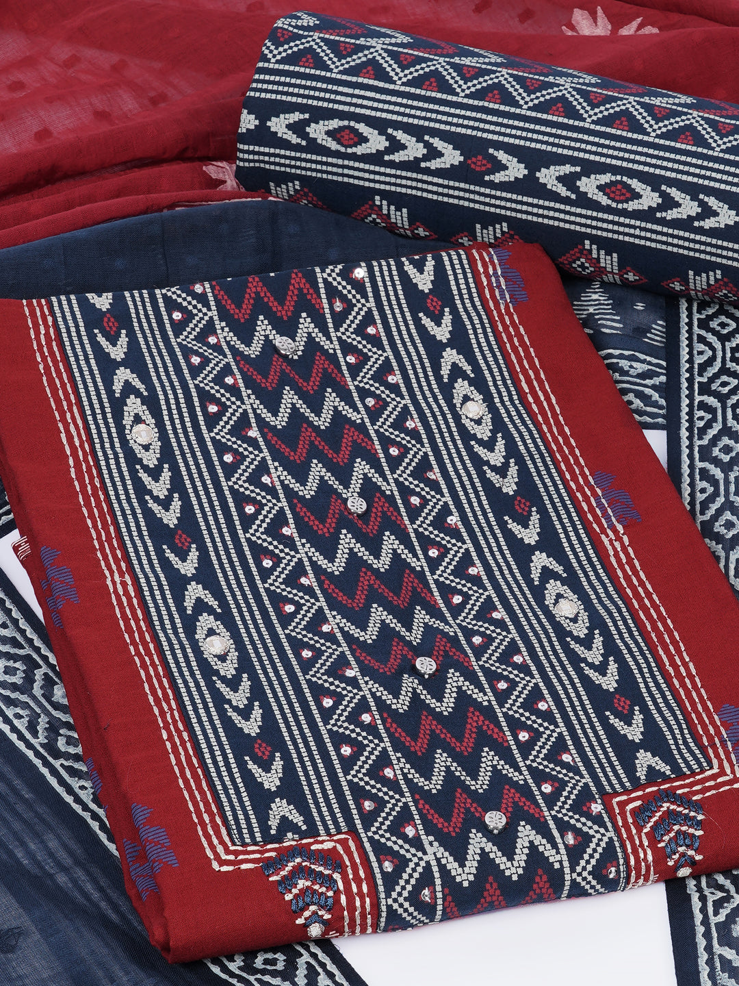 3-piece unstitched suit set featuring a butti-printed kurta with coordinated yoke detailing.