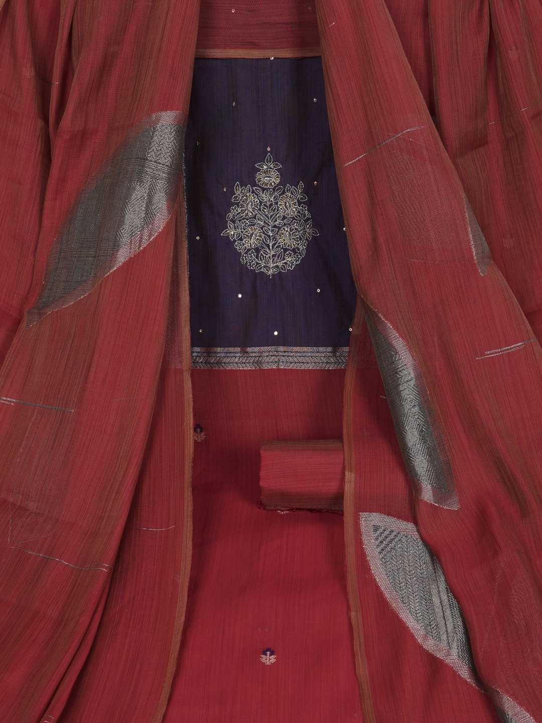 Unstitched suit set in elegant tussar silk featuring a contrast blue yoke with delicate zari work.(Maroon)