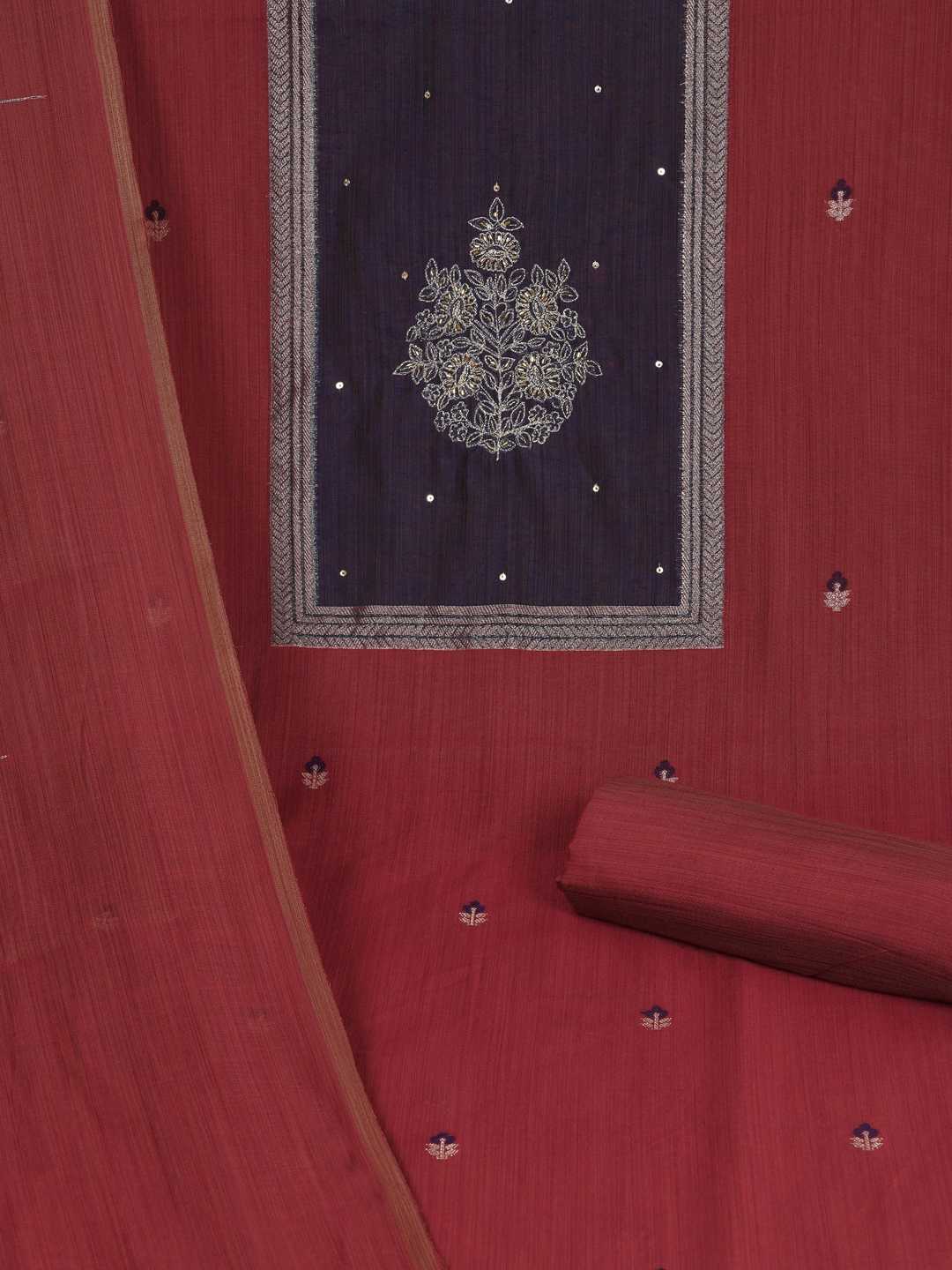 Unstitched suit set in elegant tussar silk featuring a contrast blue yoke with delicate zari work.(Maroon)