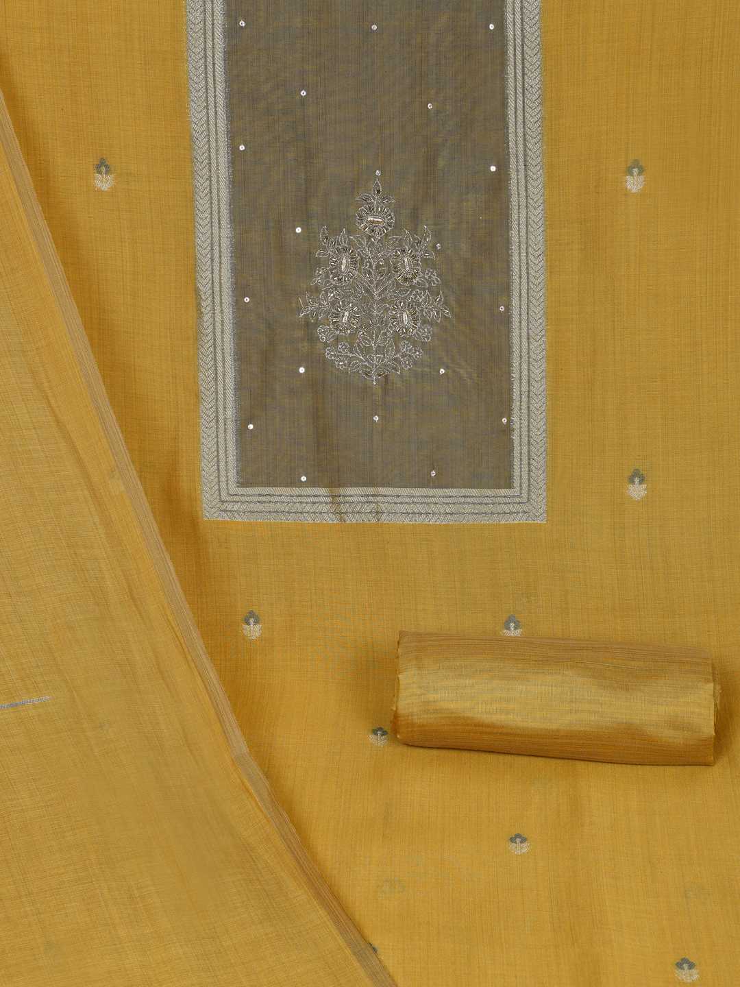 Unstitched suit set in elegant tussar silk featuring a contrast blue yoke with delicate zari work.(Yellow)