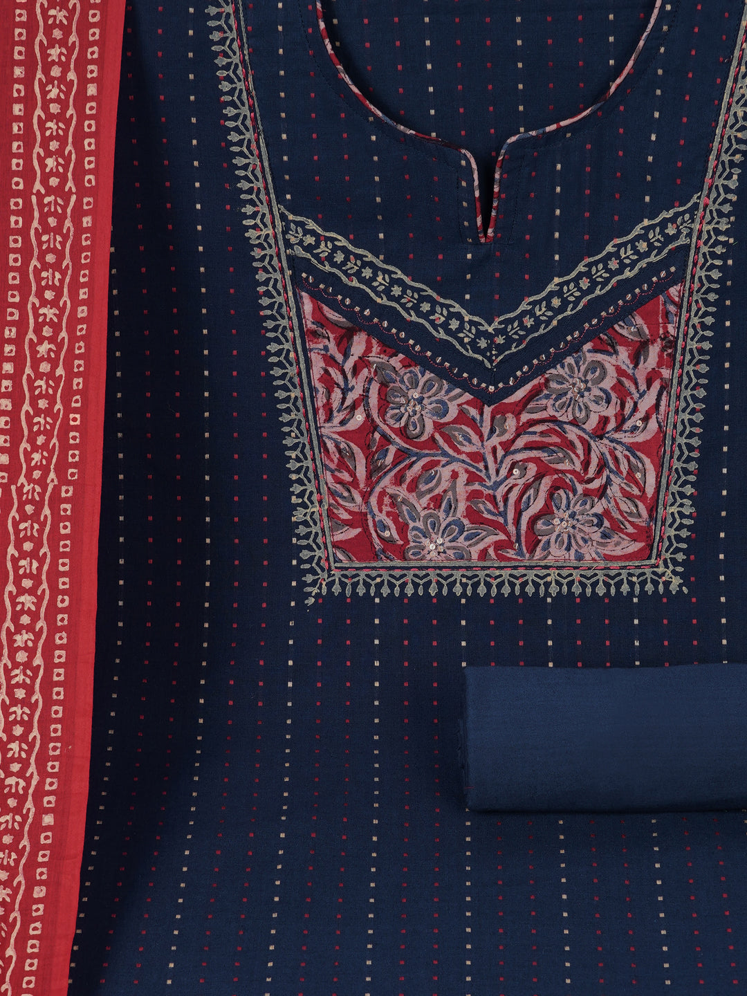 Unstitched suit set crafted in dobby fabric features a handcrafted Kalamkari printed patch.
