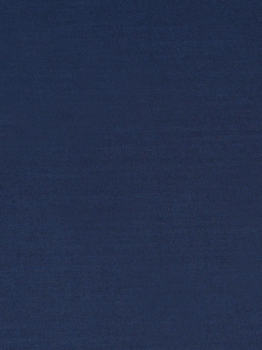 Unstitched suit set crafted in dobby fabric features a handcrafted Kalamkari printed patch.