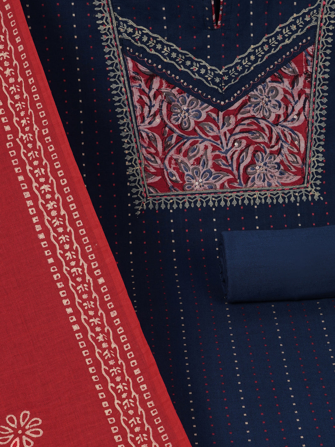Unstitched suit set crafted in dobby fabric features a handcrafted Kalamkari printed patch.